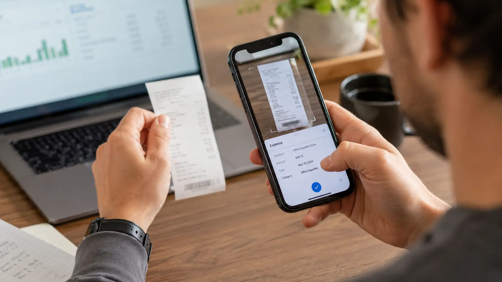 Self-employed professional capturing receipt with phone for expense tracking