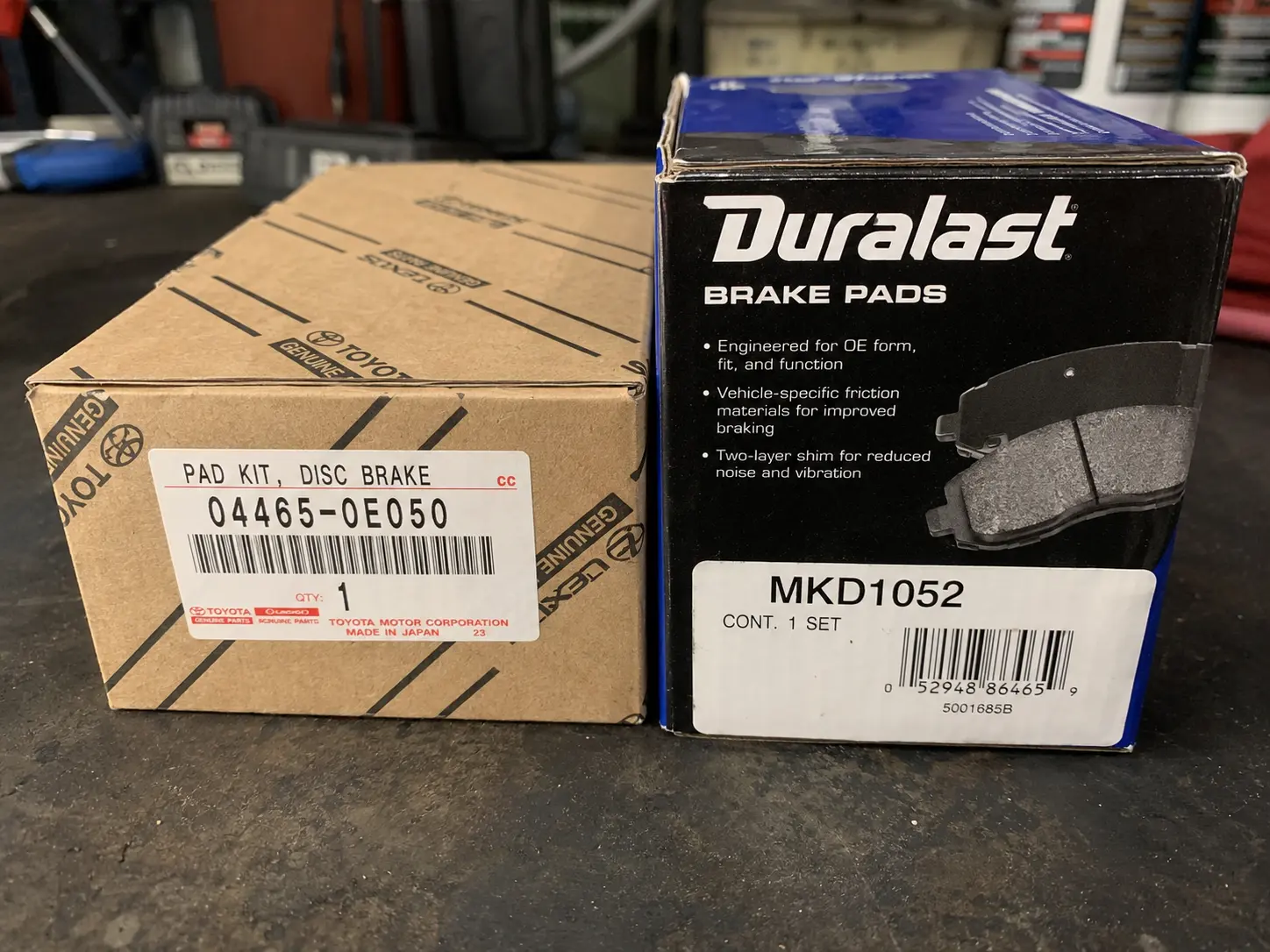 OEM brake pads packaging next to a Bosch aftermarket equivalent showing part numbers OEM brake pads packaging next to a Bosch aftermarket equivalent showing part numbers