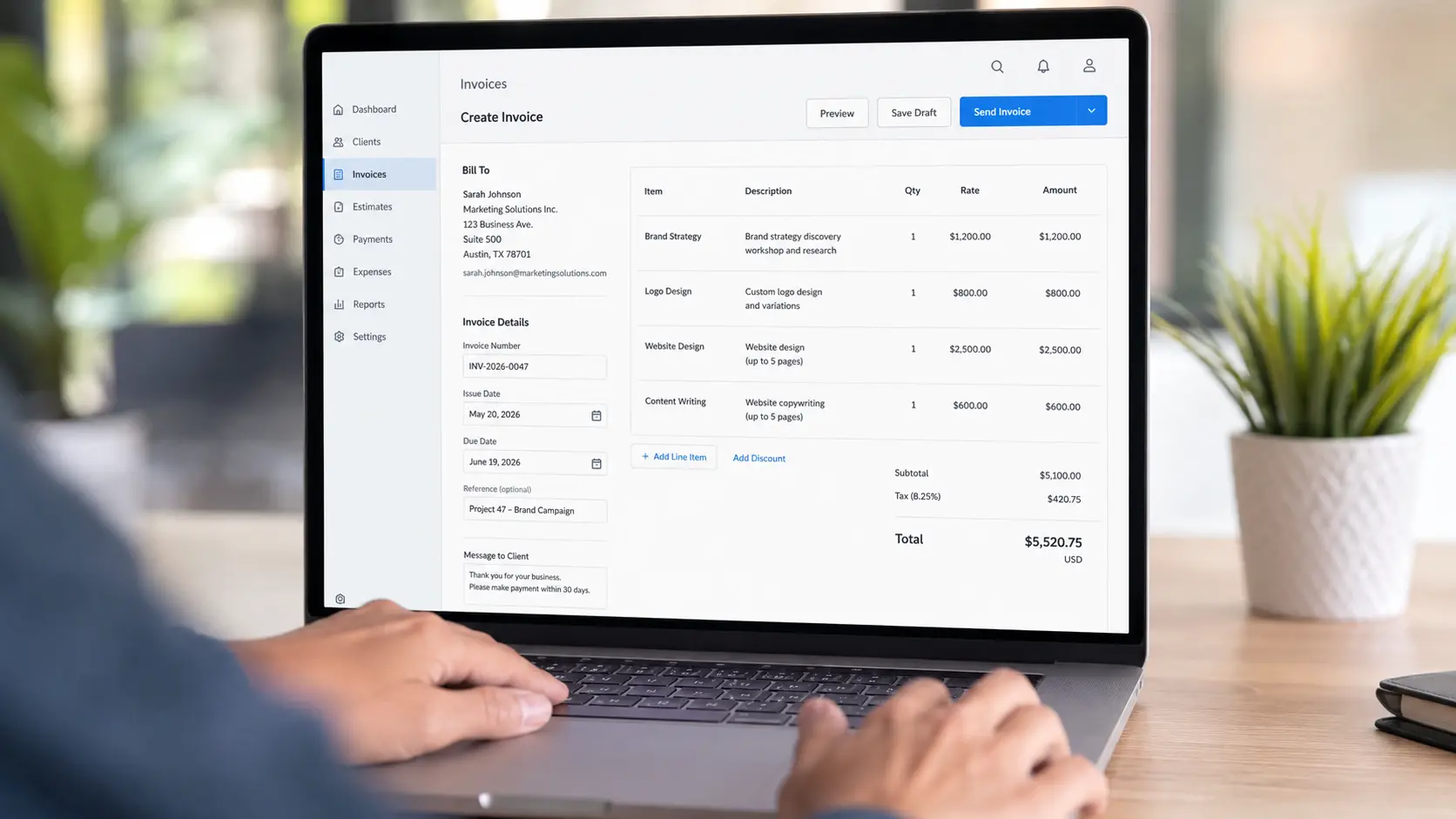 Freelancer creating professional invoice on accounting software &mdash; FreshBooks 2026